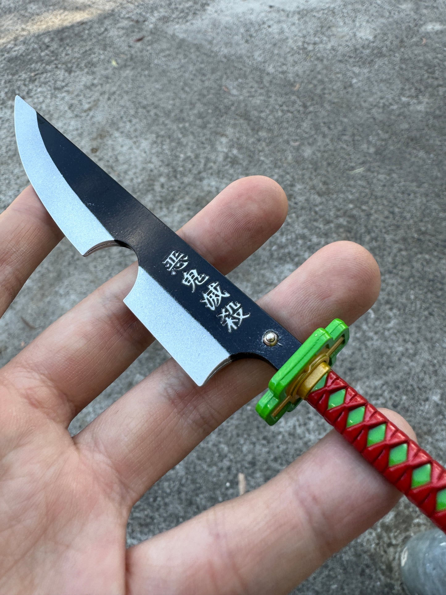 DEMON SLAYER – TENGEN UZUI’S NICHIRIN CLEAVER KEYCHAIN